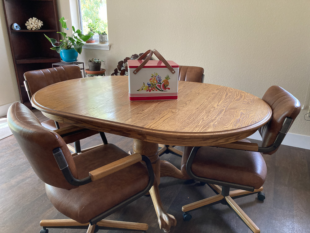 vintage oak table with 4 Naugahyde coaster chairs